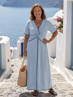 Maya twist front midi dress in soft green, featuring short sleeves and a relaxed, casual style. 1