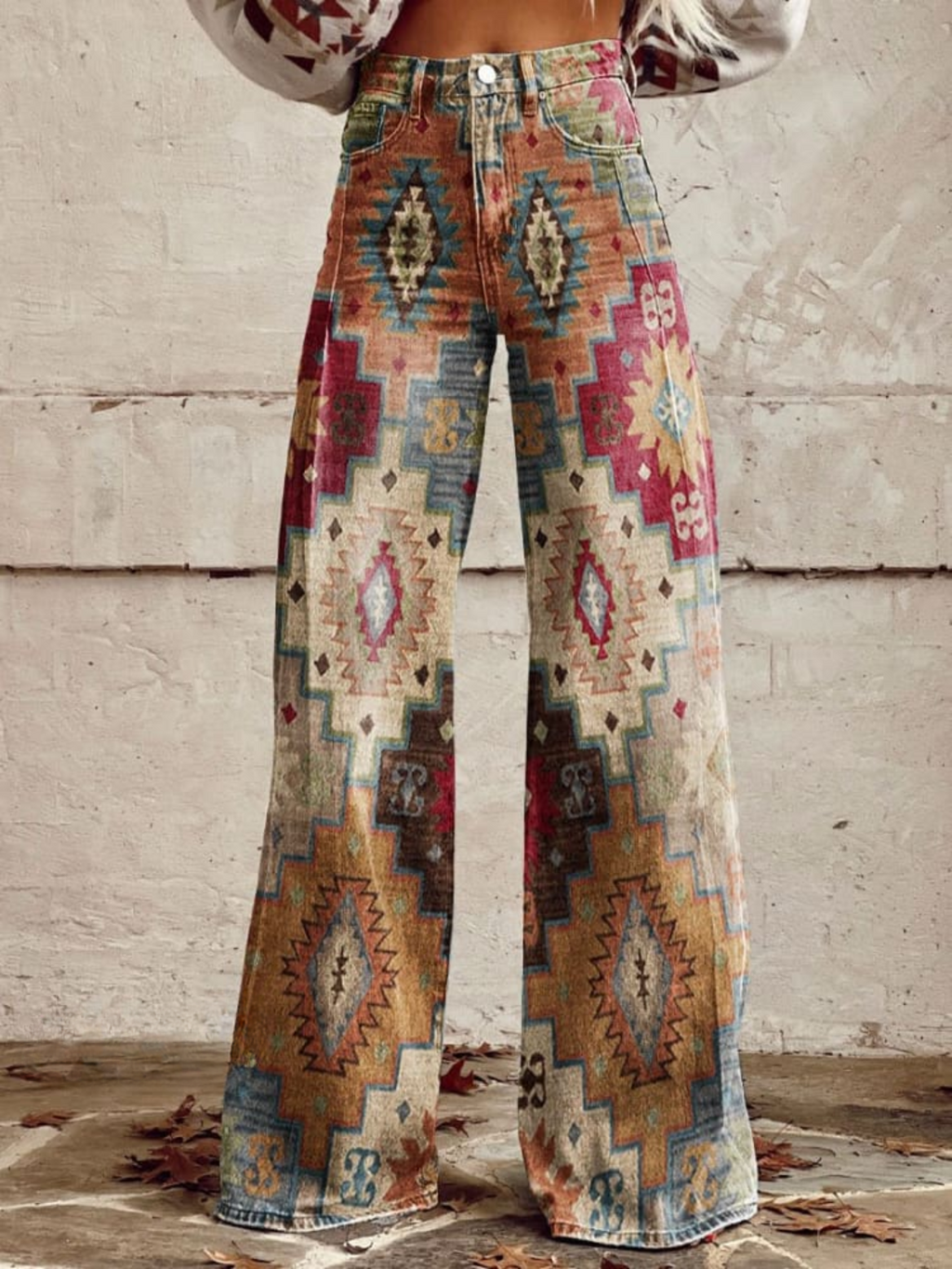 Maya wide leg pants featuring a chevron pattern in soft beige and cream tones, offering a relaxed and stylish look. 0