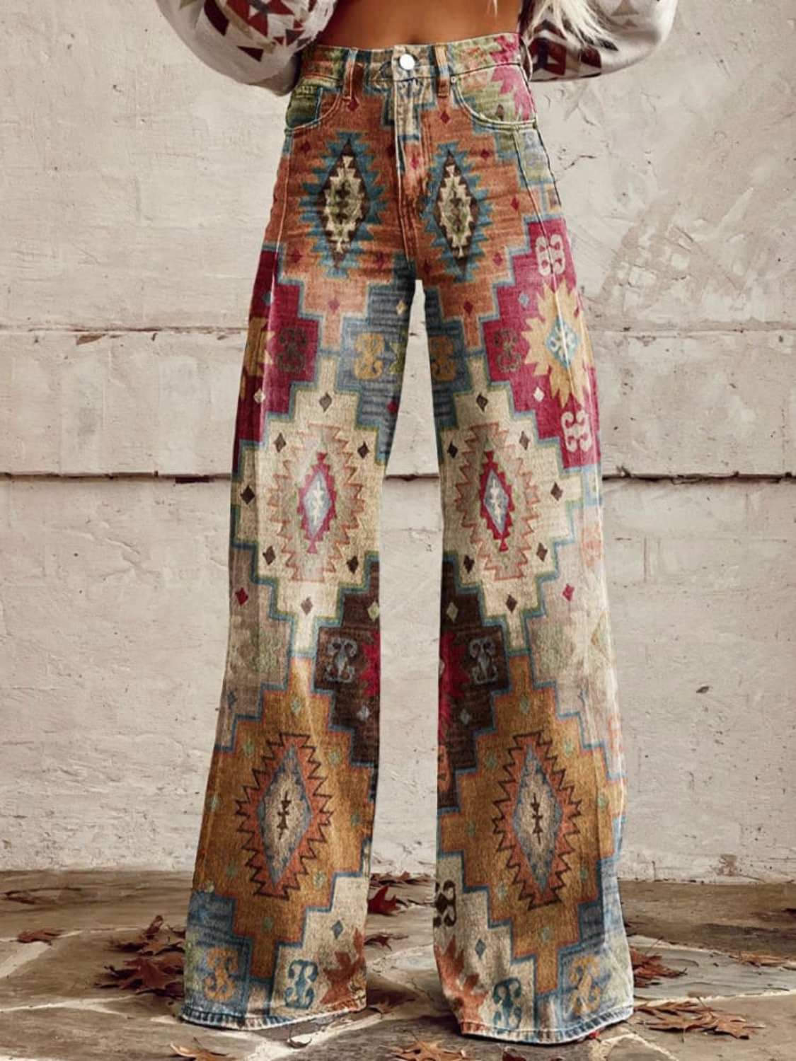 Maya wide leg pants featuring a chevron pattern in soft beige and cream tones, offering a relaxed and stylish look. 0