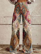 Maya wide leg pants featuring a chevron pattern in soft beige and cream tones, offering a relaxed and stylish look. 1
