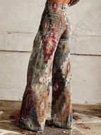 Maya wide leg pants featuring a chevron pattern in soft beige and cream tones, offering a relaxed and stylish look. 2