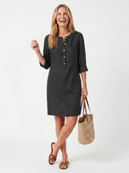 A knee-length dress in navy blue with a button front and three-quarter sleeves, showcasing a casual yet elegant style. 4