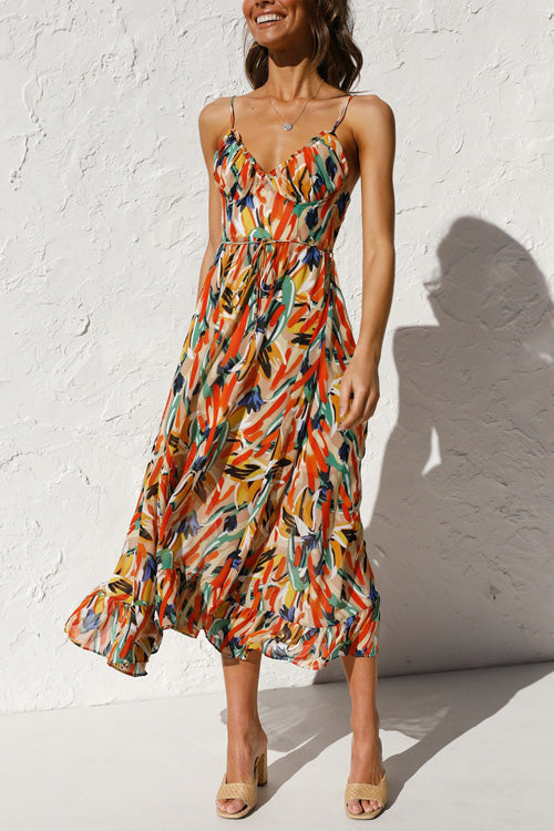 Mia summer dress in a vibrant floral print, featuring a V-neck and a relaxed sling style, made from a soft cotton blend. 0