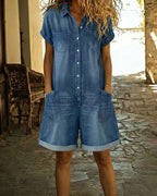 Light blue denim short sleeve jumpsuit with a relaxed fit and side pockets. Casual and comfortable style. 0