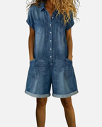 Light blue denim short sleeve jumpsuit with a relaxed fit and side pockets. Casual and comfortable style. 1