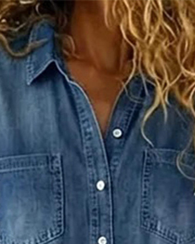 Light blue denim short sleeve jumpsuit with a relaxed fit and side pockets. Casual and comfortable style. 3