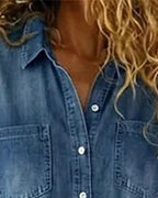 Light blue denim short sleeve jumpsuit with a relaxed fit and side pockets. Casual and comfortable style. 3