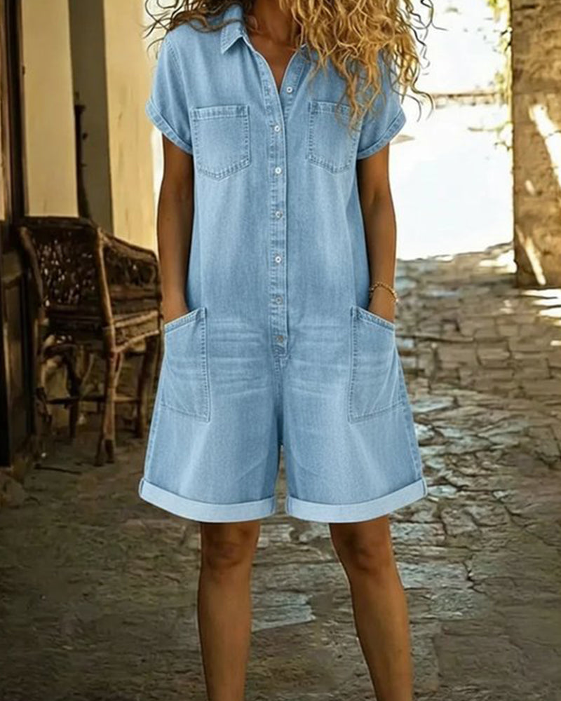 Light blue denim short sleeve jumpsuit with a relaxed fit and side pockets. Casual and comfortable style. 9