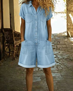 Light blue denim short sleeve jumpsuit with a relaxed fit and side pockets. Casual and comfortable style. 9