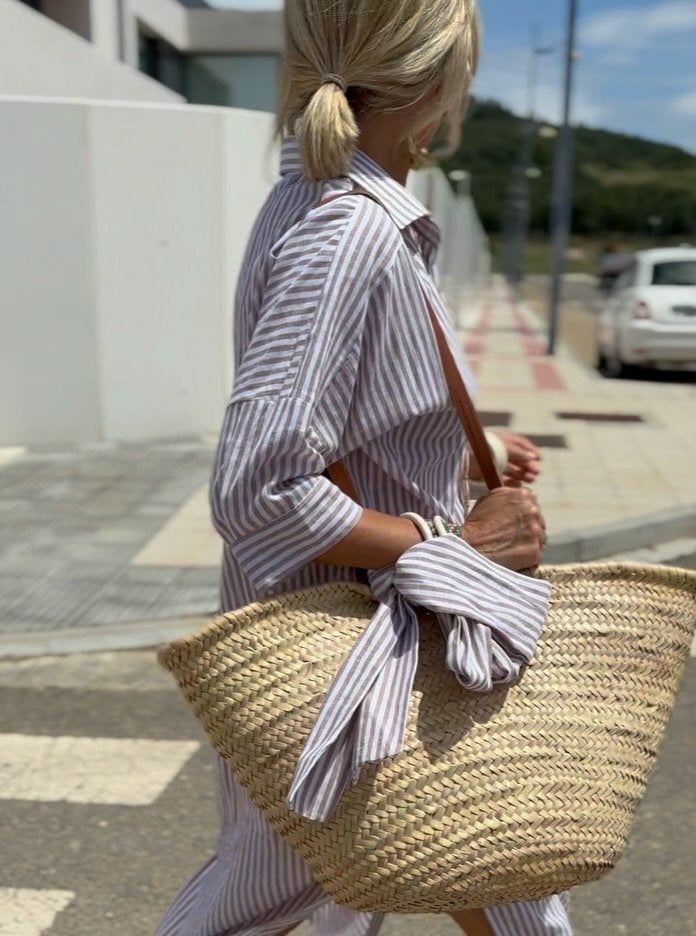Mia striped shirt dress in soft fabric, featuring a button placket, with a blend of pastel colors and a casual style. 1