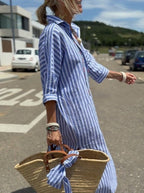 Mia striped shirt dress in soft fabric, featuring a button placket, with a blend of pastel colors and a casual style. 5