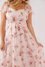 Blush pink midi dress with a floral pattern and flutter sleeves, perfect for wedding guests. 2