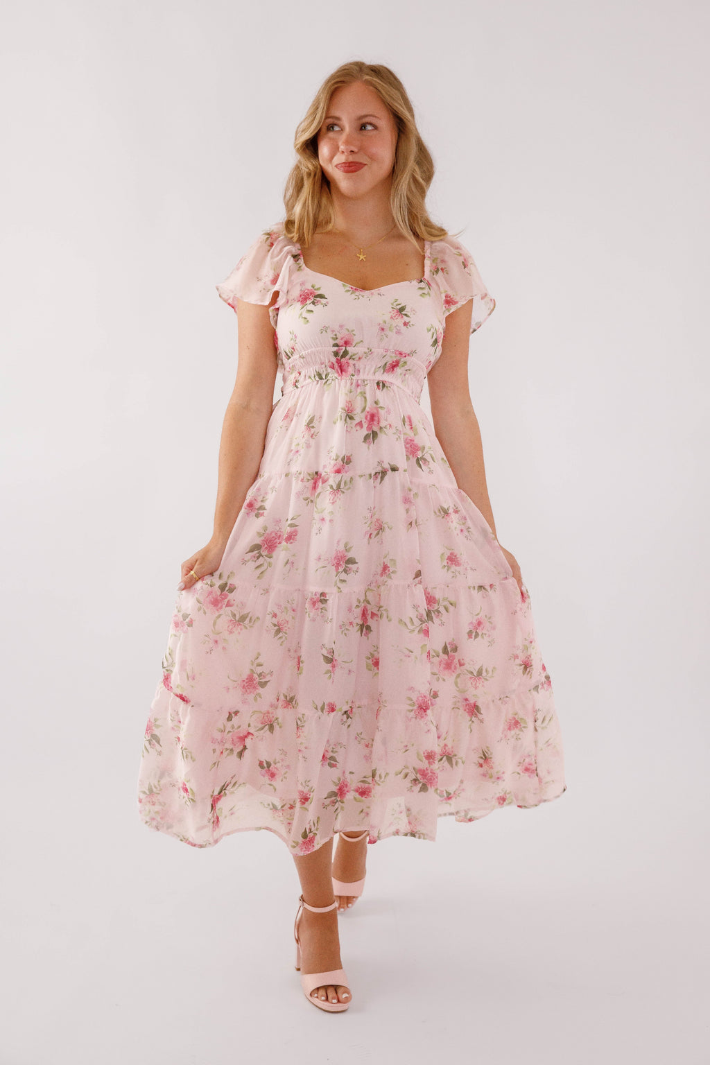 Blush pink midi dress with a floral pattern and flutter sleeves, perfect for wedding guests. 7