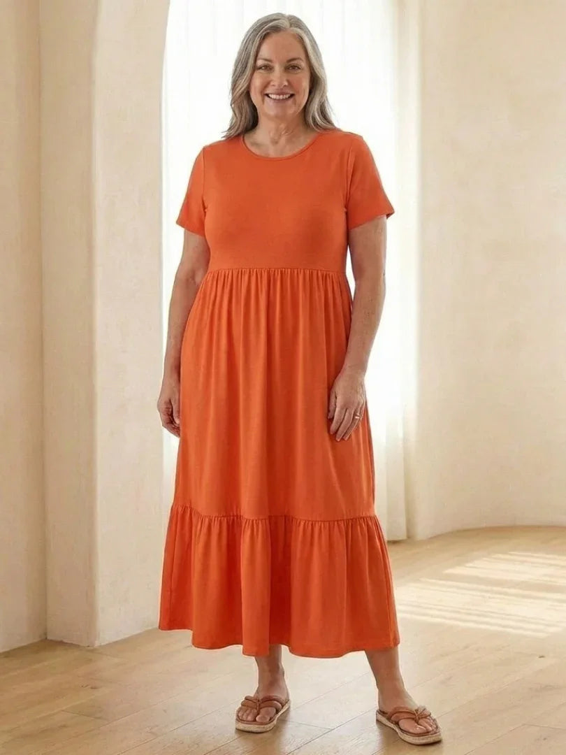 Nerissa round neck short sleeve tiered midi dress in soft blue cotton, featuring a relaxed fit and pockets. 3