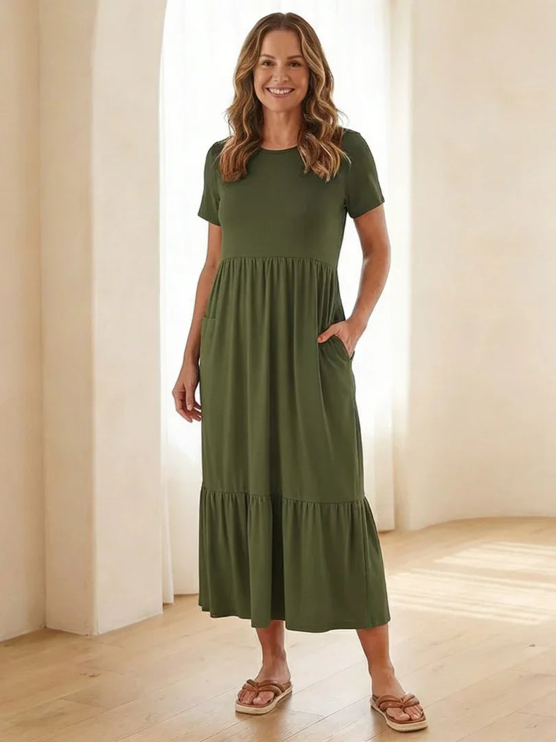 Nerissa round neck short sleeve tiered midi dress in soft blue cotton, featuring a relaxed fit and pockets. 4