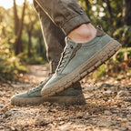 Men's classic lace-up sneakers in navy blue, featuring a minimalistic design and comfortable fit. 1