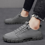 Men's classic lace-up sneakers in navy blue, featuring a minimalistic design and comfortable fit. 8