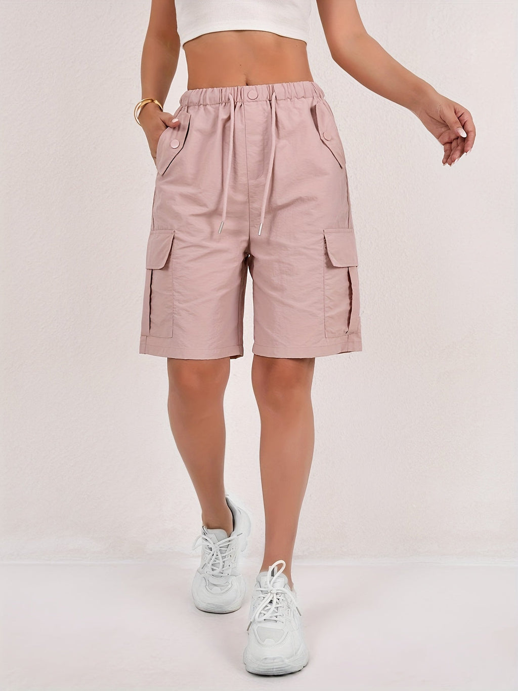 Olive green cargo shorts for women with a quick-dry fabric and multiple pockets, perfect for casual outdoor activities. 0