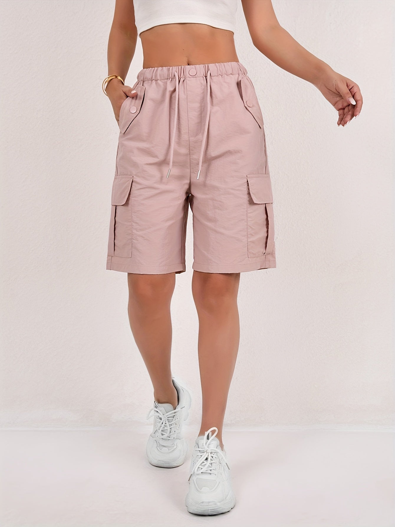 Olive green cargo shorts for women with a quick-dry fabric and multiple pockets, perfect for casual outdoor activities. 0