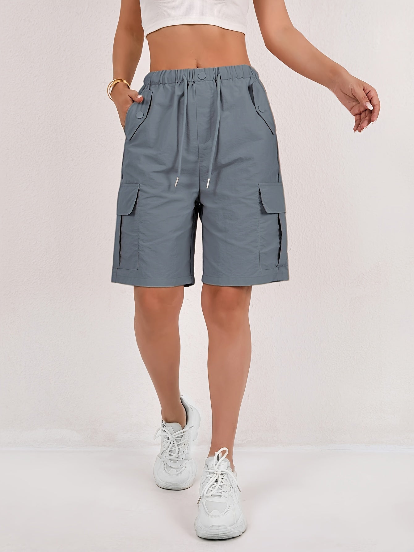 Olive green cargo shorts for women with a quick-dry fabric and multiple pockets, perfect for casual outdoor activities. 10