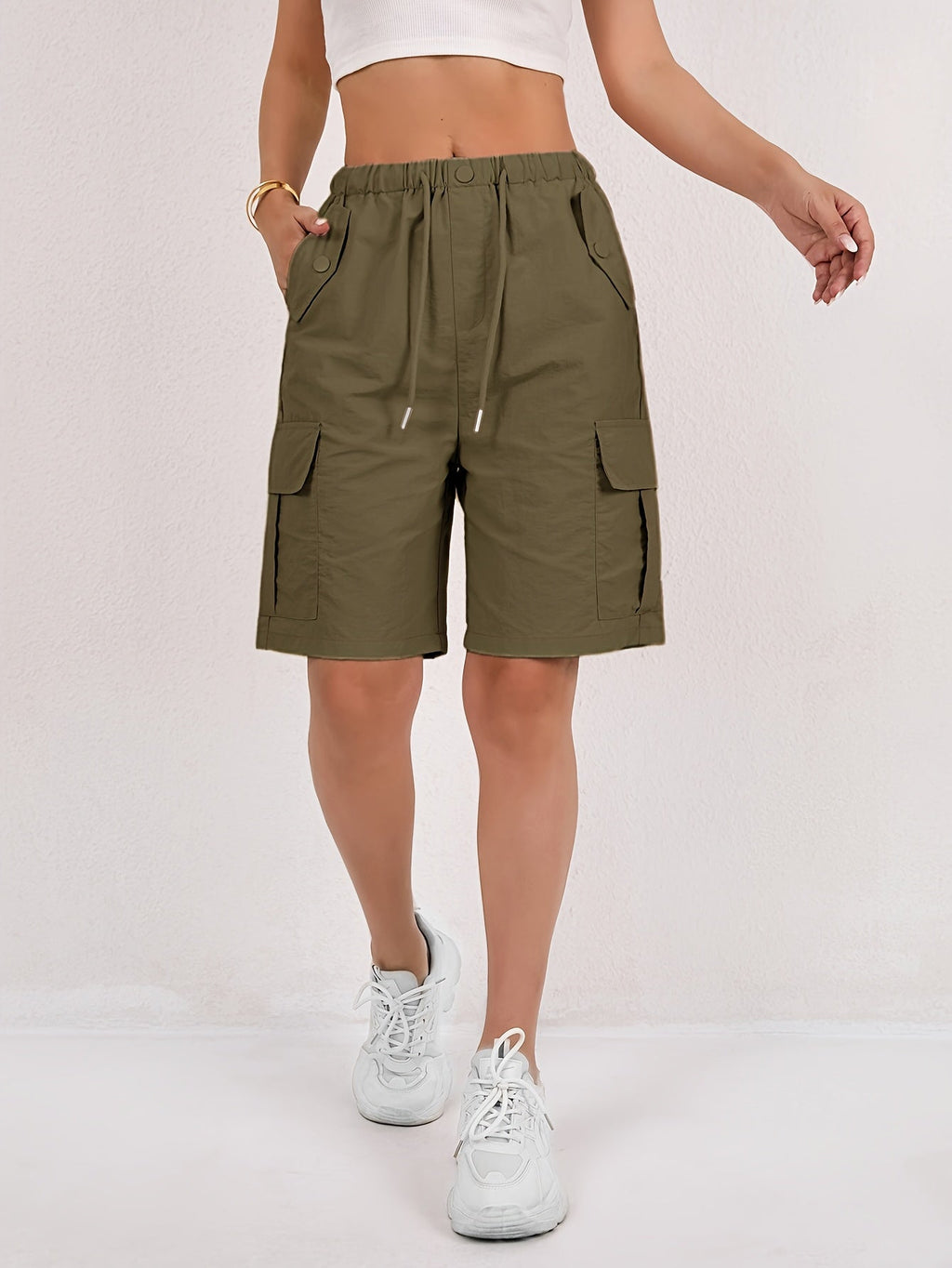 Olive green cargo shorts for women with a quick-dry fabric and multiple pockets, perfect for casual outdoor activities. 12
