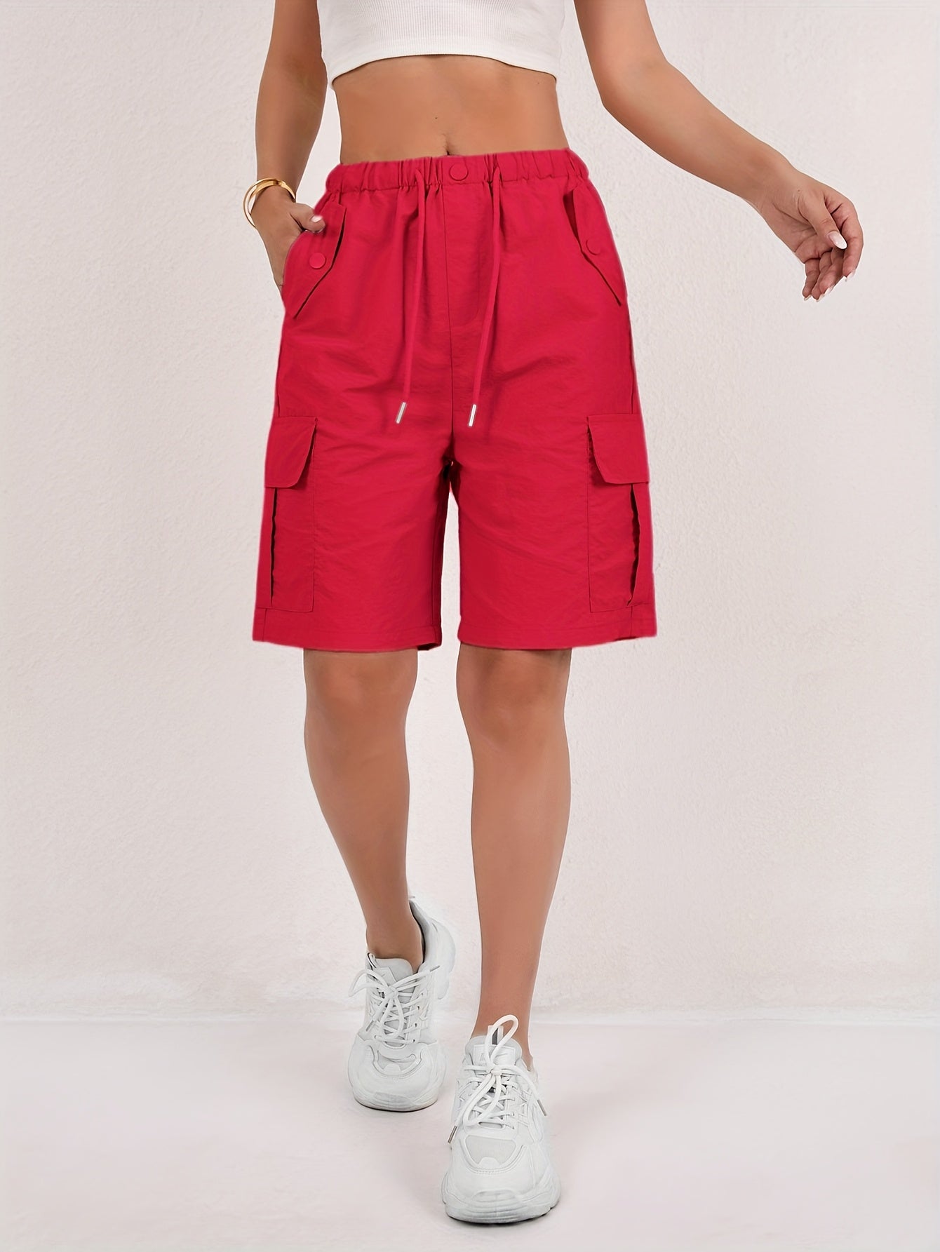 Olive green cargo shorts for women with a quick-dry fabric and multiple pockets, perfect for casual outdoor activities. 6