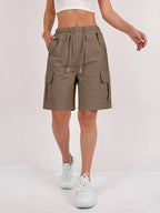 Olive green cargo shorts for women with a quick-dry fabric and multiple pockets, perfect for casual outdoor activities. 7