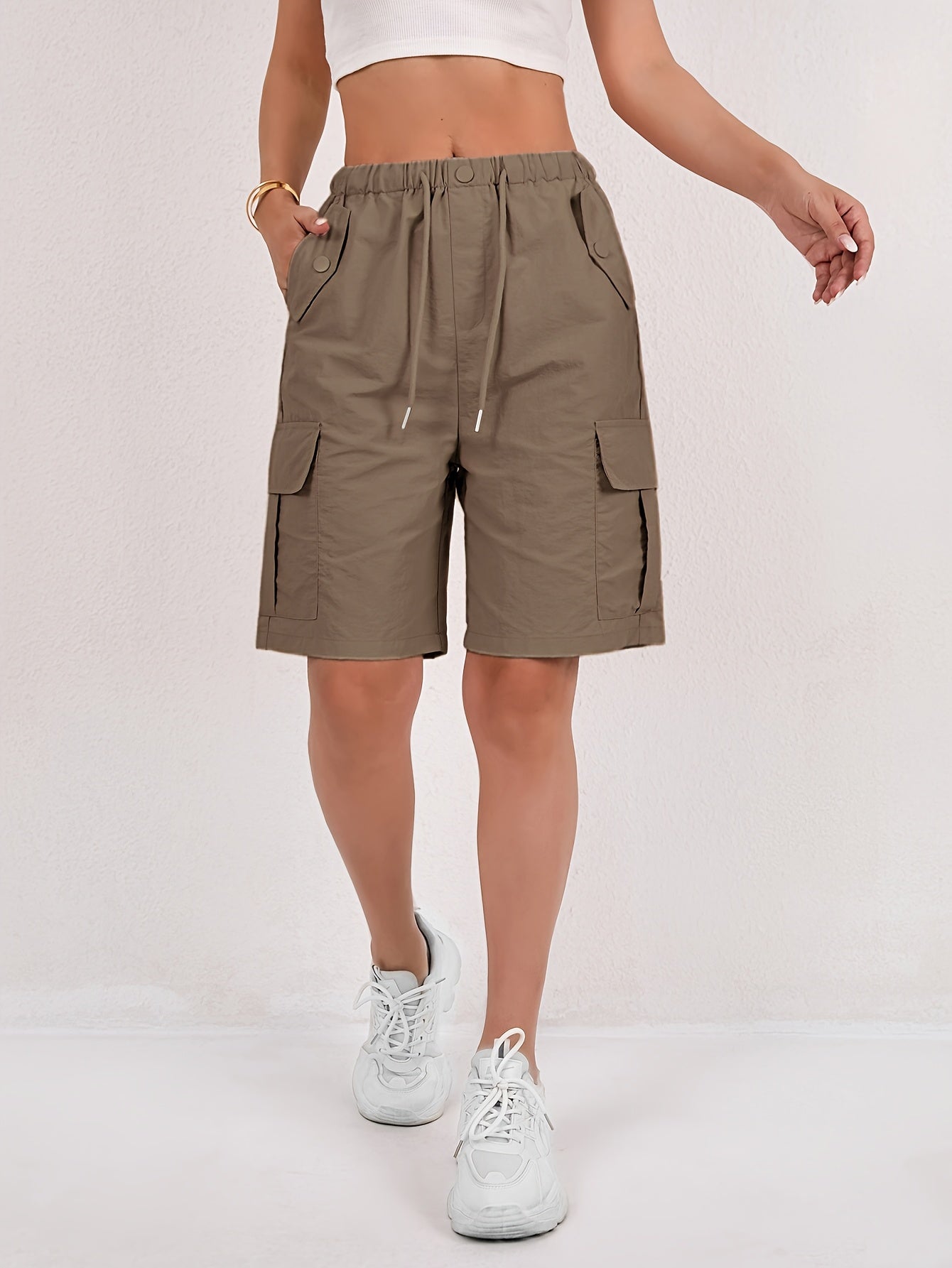 Olive green cargo shorts for women with a quick-dry fabric and multiple pockets, perfect for casual outdoor activities. 7