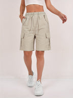 Olive green cargo shorts for women with a quick-dry fabric and multiple pockets, perfect for casual outdoor activities. 8