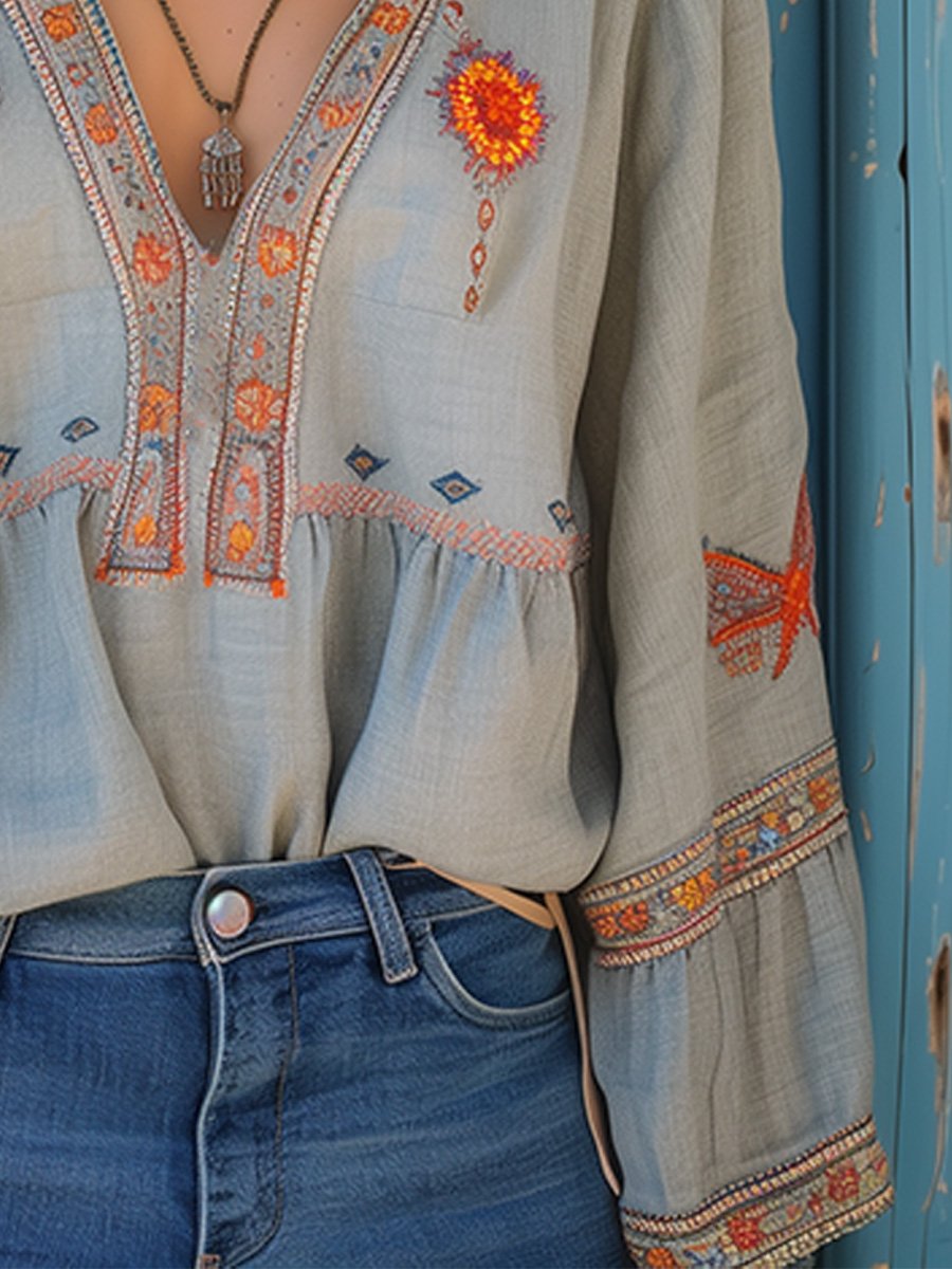 Flowy white bohemian blouse with delicate lace details and vibrant floral patterns. 4