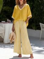 Lightweight two-piece co-ord set in pastel stripes, featuring a relaxed fit and casual style. 3