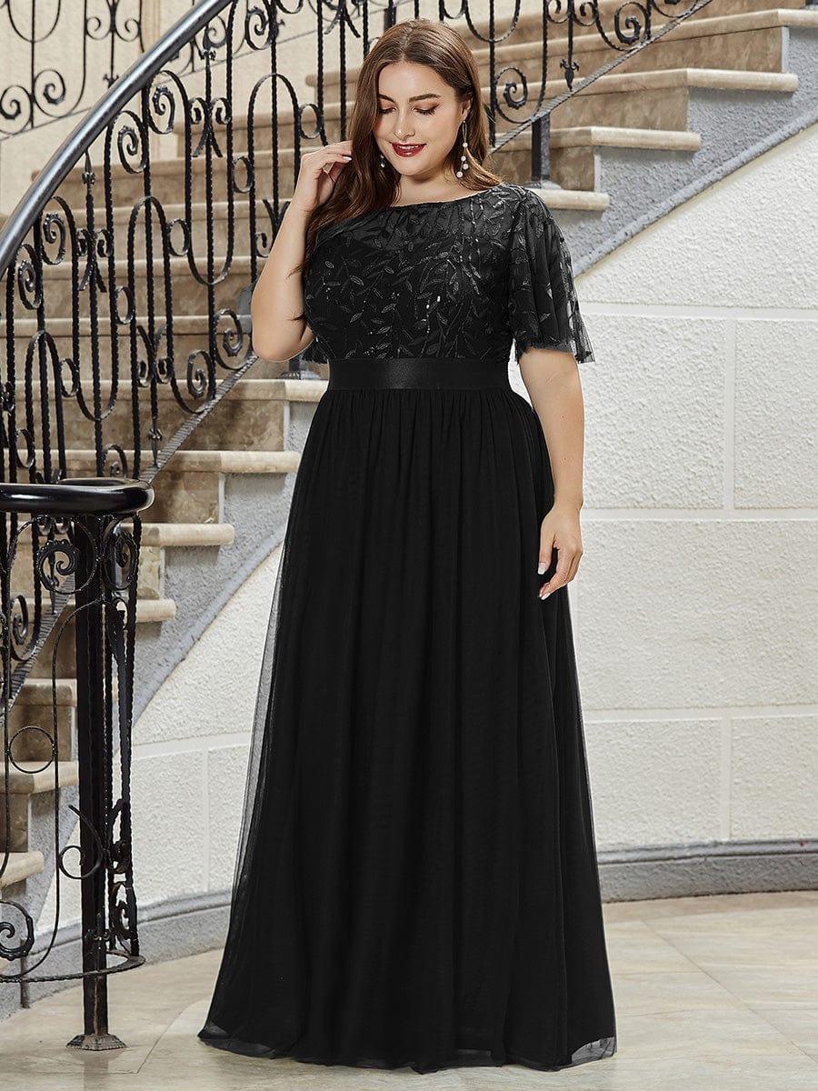 Plus size evening dress in deep blue, featuring embroidered details and elegant ruffle sleeves. Floor-length style. 12