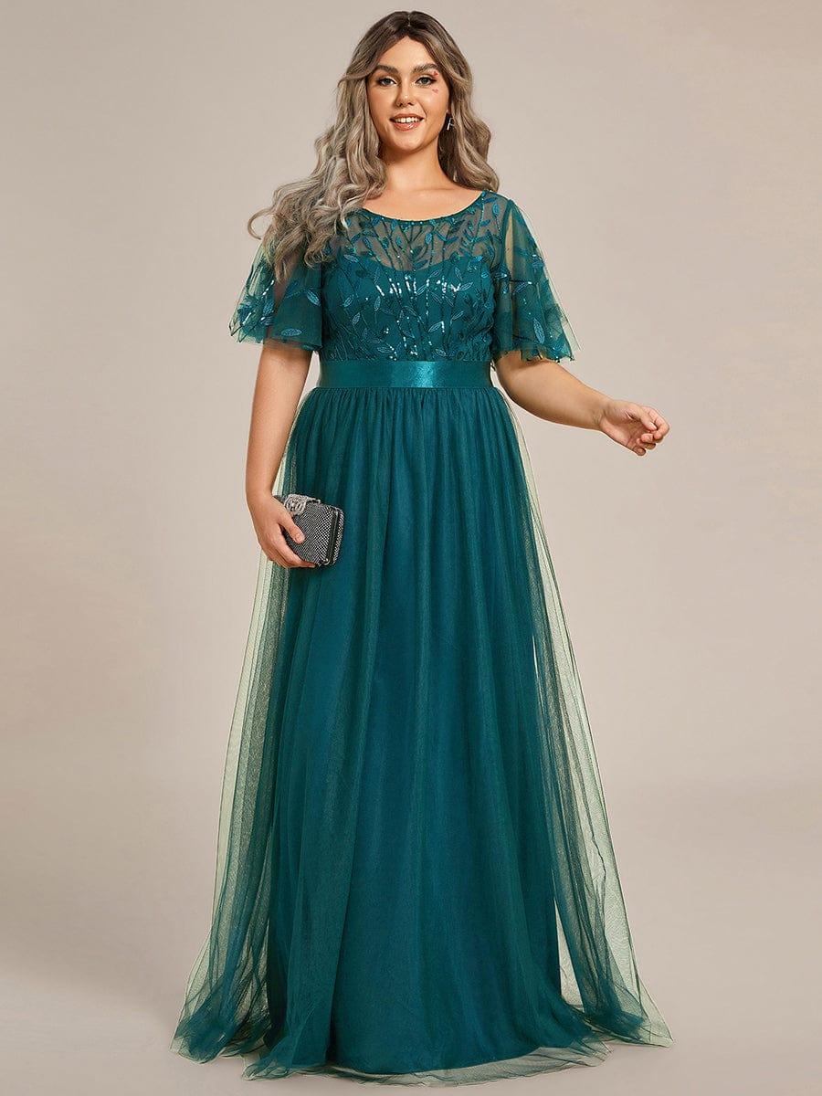Plus size evening dress in deep blue, featuring embroidered details and elegant ruffle sleeves. Floor-length style. 15