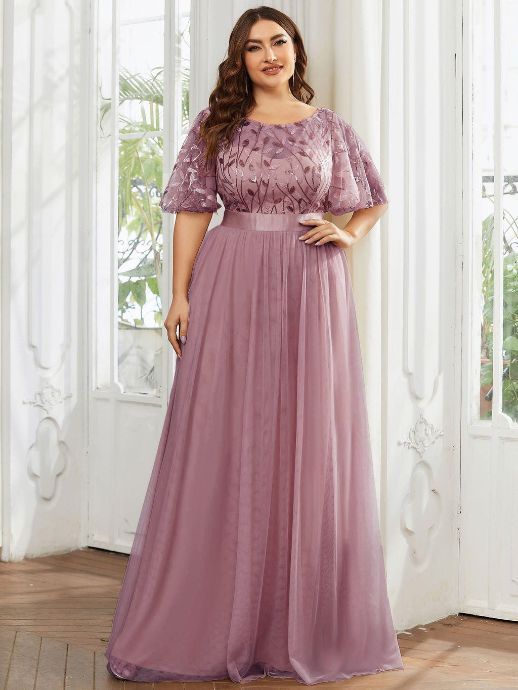 Plus size evening dress in deep blue, featuring embroidered details and elegant ruffle sleeves. Floor-length style. 19