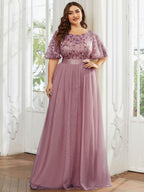 Plus size evening dress in deep blue, featuring embroidered details and elegant ruffle sleeves. Floor-length style. 19
