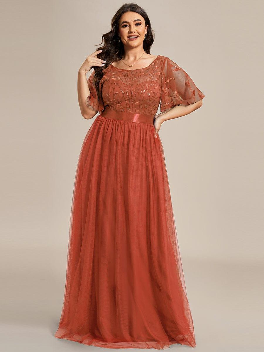 Plus size evening dress in deep blue, featuring embroidered details and elegant ruffle sleeves. Floor-length style. 20