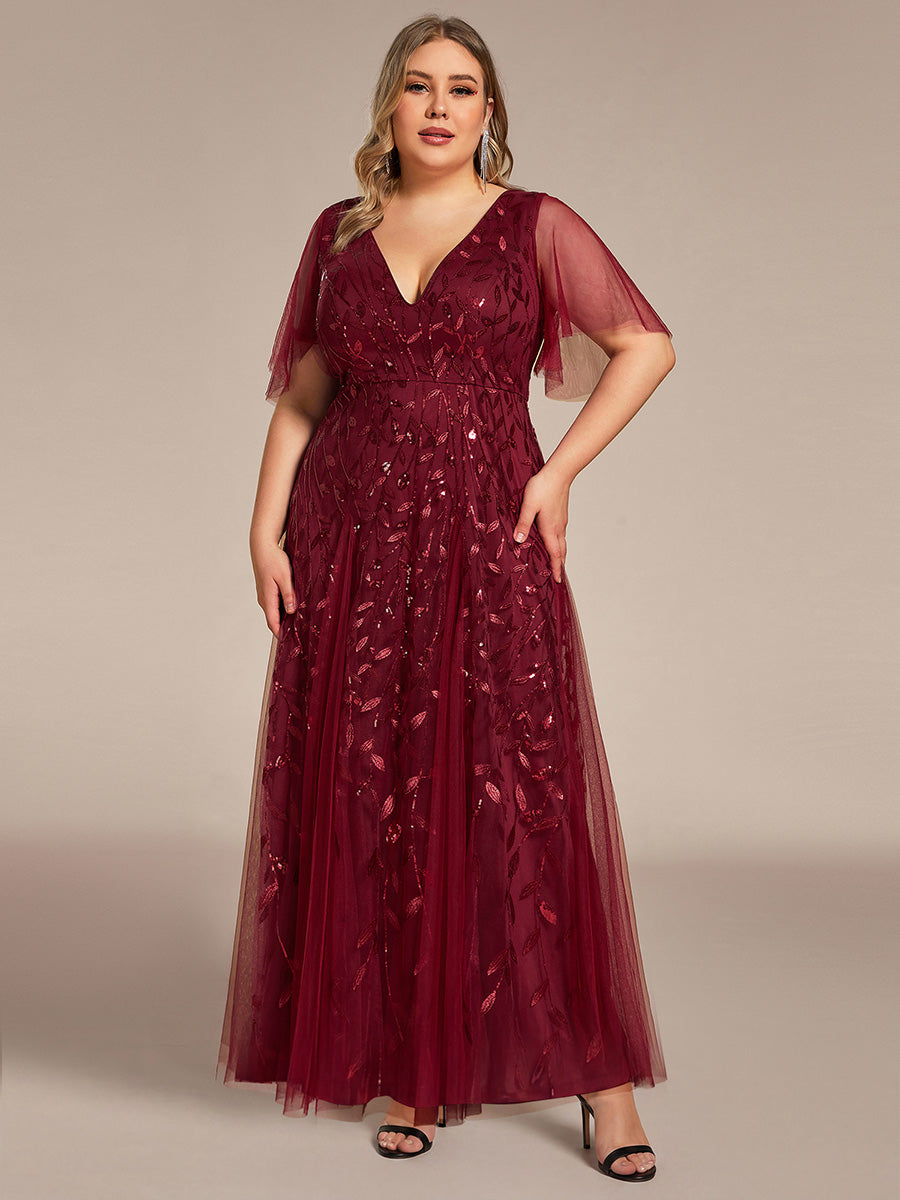 Plus size formal evening gown, navy blue, featuring ruffle sleeves and a floor-length silhouette. 13