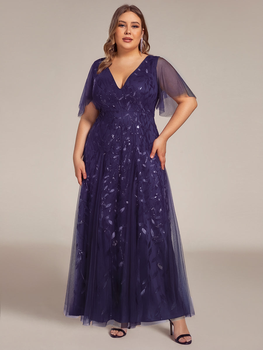 Plus size formal evening gown, navy blue, featuring ruffle sleeves and a floor-length silhouette. 17