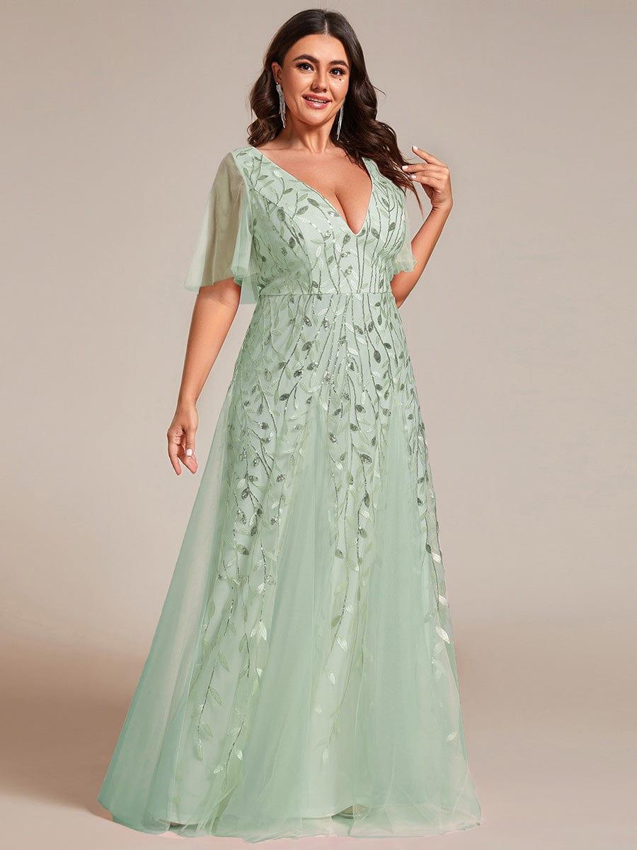 Plus size formal evening gown, navy blue, featuring ruffle sleeves and a floor-length silhouette. 19