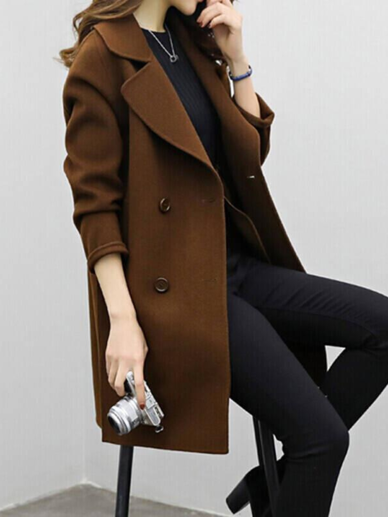 Longline double-breasted coat for women with wide notched lapels.