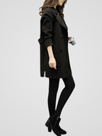 Longline double-breasted coat for women with wide notched lapels.