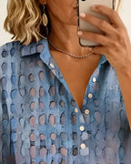 Short sleeve blouse in white with black polka dots, featuring a relaxed fit and elegant collar style. 6