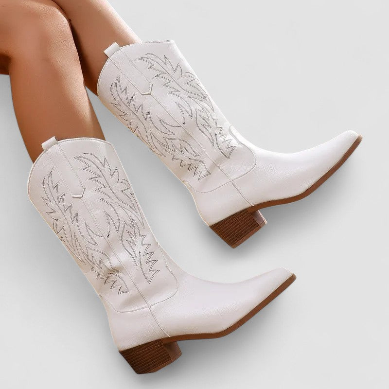 Women's orthopedic leather-look mid-calf western boots with tonal flame stitching.