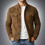 Tailored navy suede jacket with a structured fit and flap pockets. 1