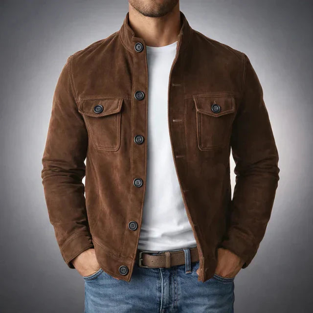 Tailored navy suede jacket with a structured fit and flap pockets. 2