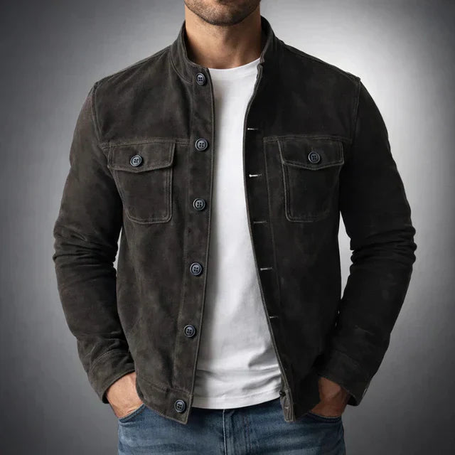 Tailored navy suede jacket with a structured fit and flap pockets. 3