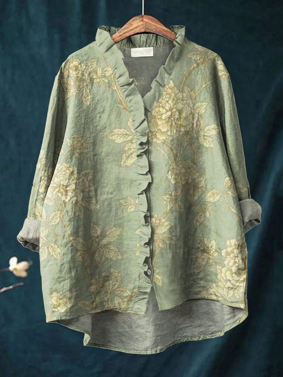 Light pink floral blouse with short sleeves and a relaxed fit. 0
