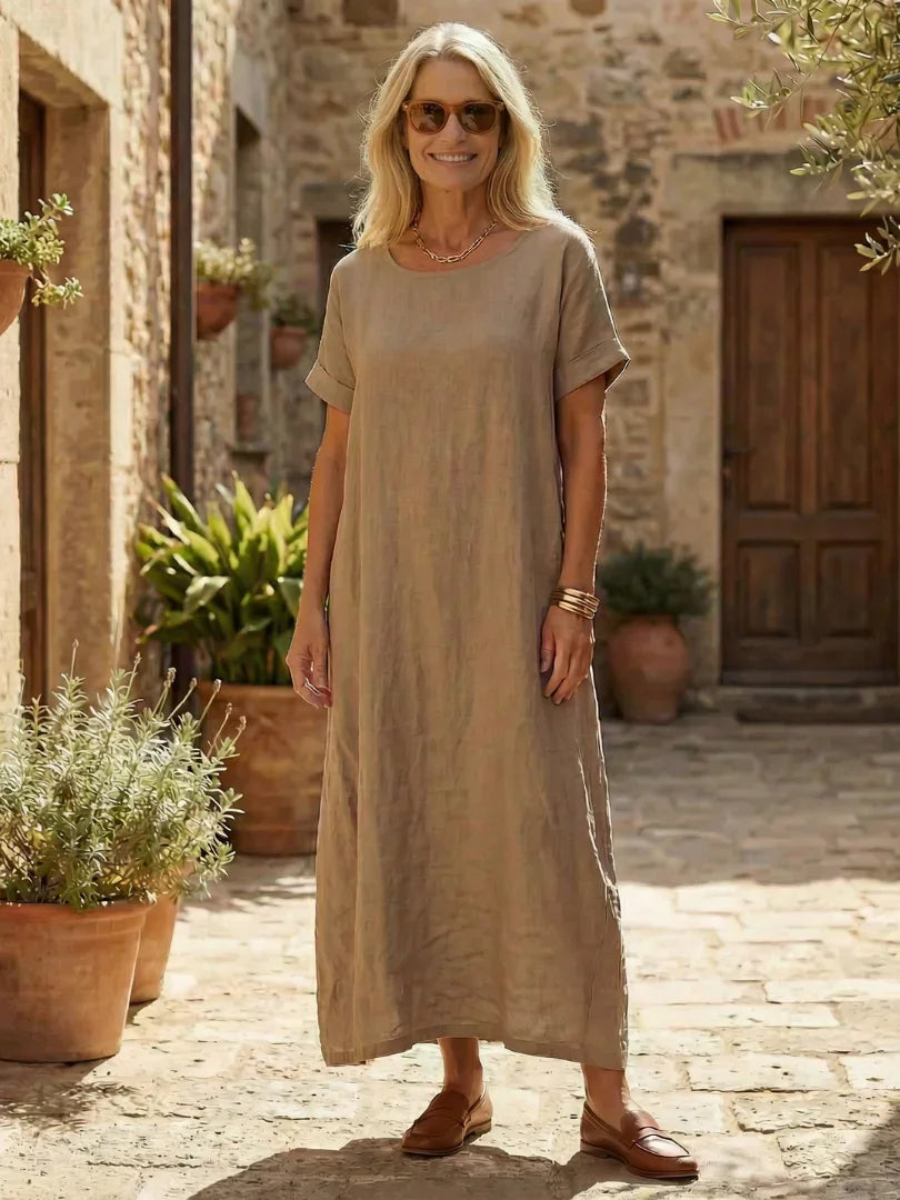 White midi linen day dress with a round neckline and simple style. 0