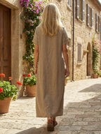 White midi linen day dress with a round neckline and simple style. 3