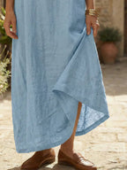 White midi linen day dress with a round neckline and simple style. 5